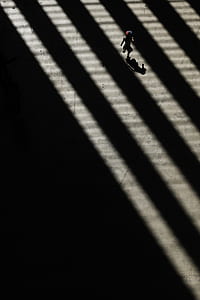 boy wearing red cap running on the concrete ground thumbnail