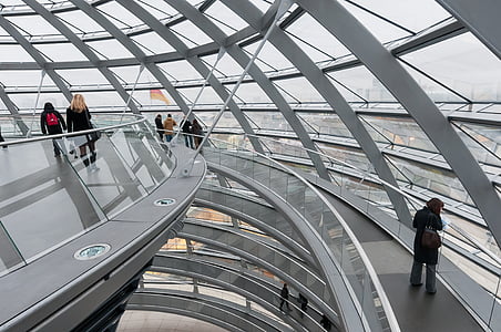people standing near glass windows of building thumbnail