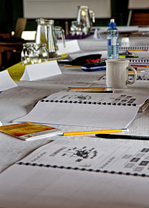 yellow pencil near yellow book on gray wooden table thumbnail