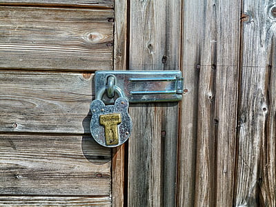 gray and brass-colored locked padlock thumbnail