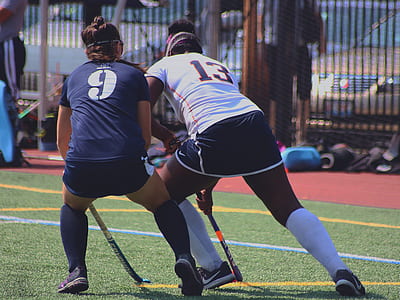 two women playing on field thumbnail