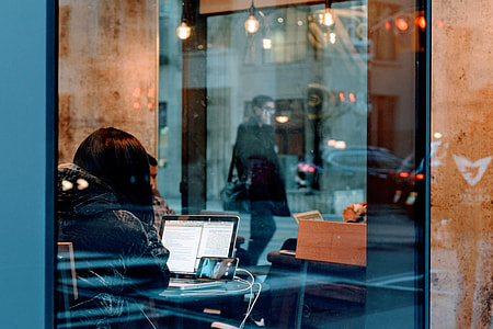 woman sitting in front of turned on laptop thumbnail