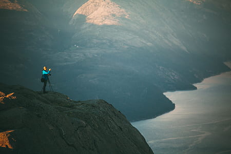 woman standing on top of mountain thumbnail