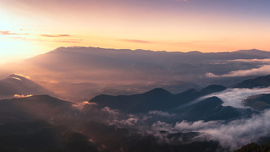 aerial photograph of mountains surrounded with clouds thumbnail