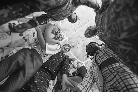 Grayscale Photo of People Together Inside Room thumbnail
