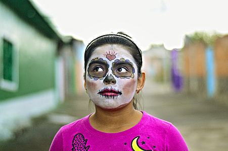 woman in white and black sugar skull face mask thumbnail