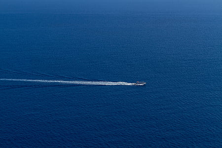 boat sailing on ocean at daytime thumbnail