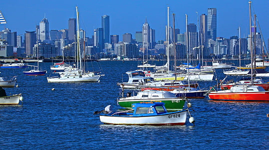 white and red boats on sea at daytime thumbnail