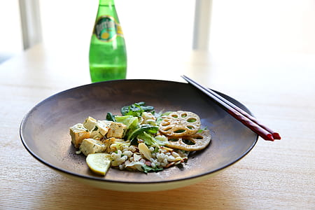 Shabu Shabu on Plate Beside Chopstick and Soda Bottle thumbnail