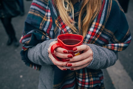 person holding ceramic heart mug thumbnail