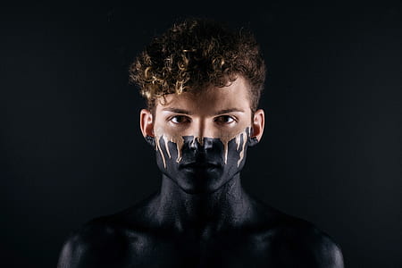 man with black body paint thumbnail