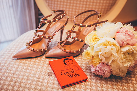 pair of heels beside flower bouquet thumbnail