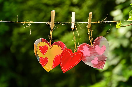 three pink-yellow-and-red heart decors thumbnail