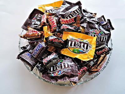 closeup photo of bowl of M&M's chocolate packs thumbnail