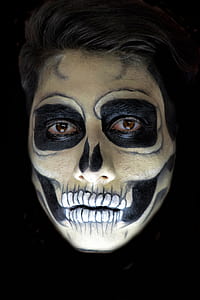 human skull themed make-up in closed-up photo thumbnail