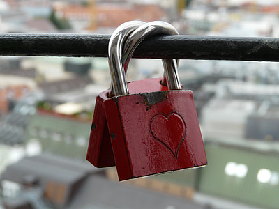 two red-and-silver locks on black bar thumbnail