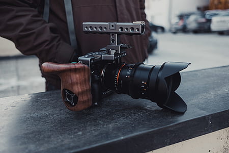 person in-front of DSLR camera thumbnail