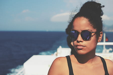 woman in blue lens sunglasses thumbnail