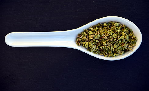 green spice on white cermic spoon thumbnail