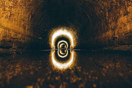 low-angle photography of tunnel with water thumbnail