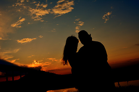 silhouette photo of couple hugging on outdoors thumbnail