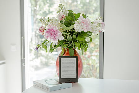 Potted Pink Petaled Flower Near Black Tablet thumbnail
