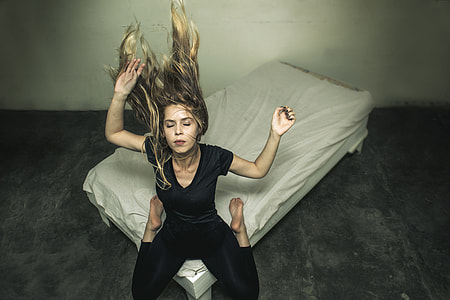 woman kneeling on bed thumbnail