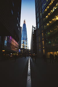 People Walking Surrounded by Buildings thumbnail