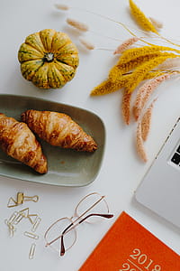 Female desk with orange notebook and pumpkins thumbnail
