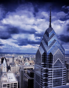 city buildings under cloudy sky thumbnail