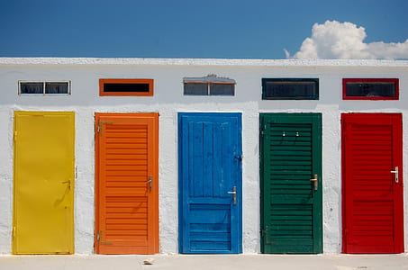 yellow, orange, blue, green, and red wooden doors thumbnail