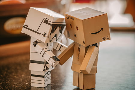Photo of White, and Brown Cardboard Box Toy Figure thumbnail