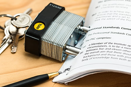 gray and black Yale padlock beside white book thumbnail