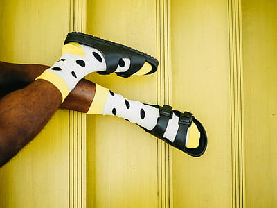person wearing black slide sandals thumbnail