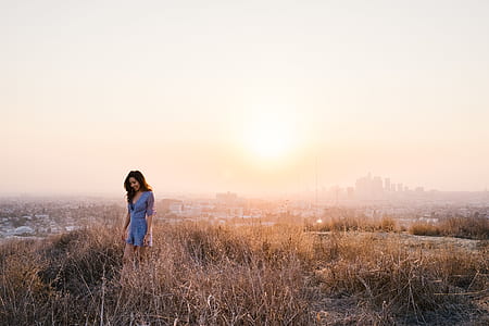 woman standing on grass field thumbnail