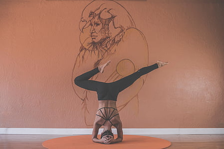 woman doing yoga near wall thumbnail