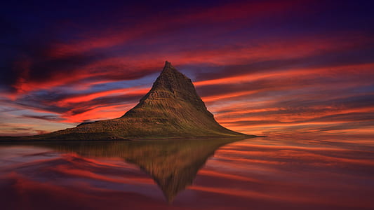brown mountain with reflection on water thumbnail