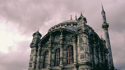 gray stone castle under nimbus clouds thumbnail