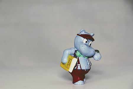 rhino toy holding book watching watch thumbnail