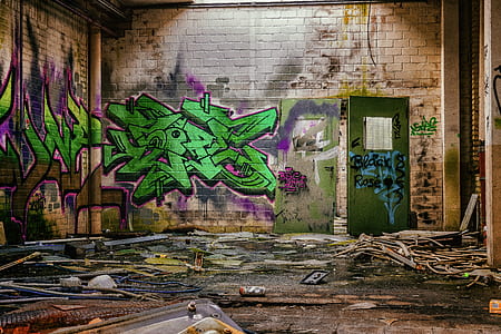 beige concrete wall with graffiti artwork thumbnail