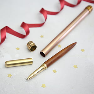 brown pen on white top thumbnail