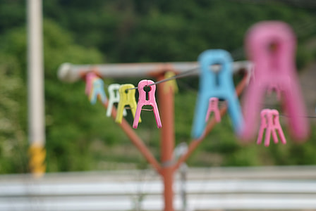 pink and yellow plastic clothes clip thumbnail