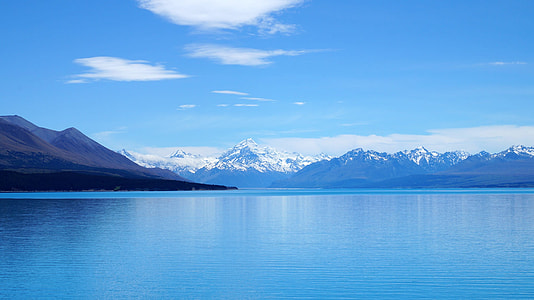 white and gray mountain near body of water at daytime thumbnail