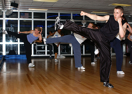 women and men exercising inside room thumbnail