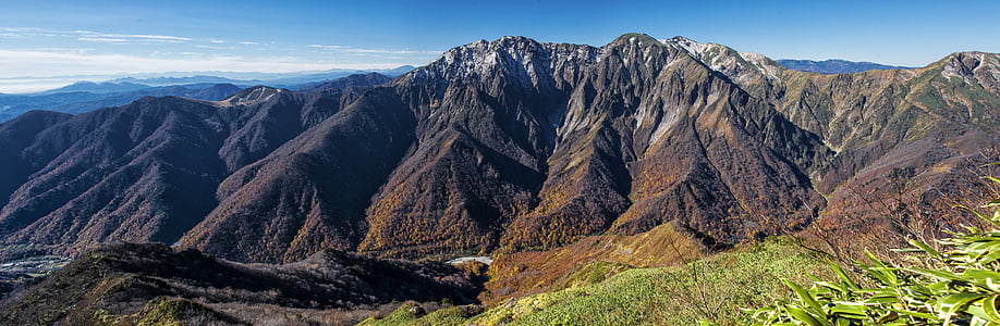 mountain range under blow sky thumbnail