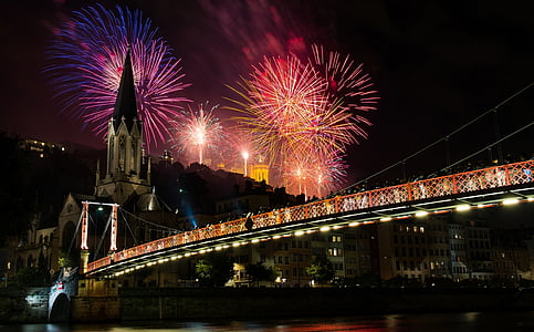 lighting fireworks above Brooklyn bridge at night low angle photography thumbnail