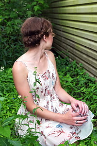 woman sitting on grass thumbnail