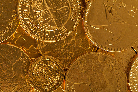 close-up photo of round gold-colored coins thumbnail