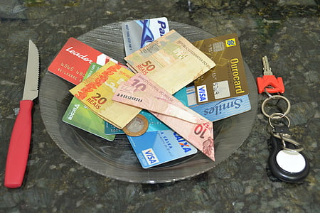 banknotes and cards on glass plate thumbnail