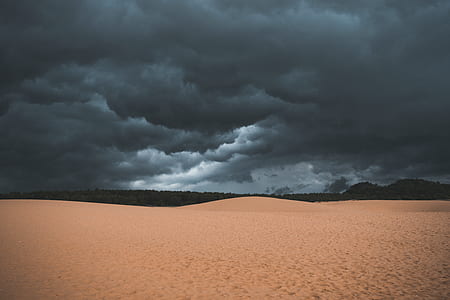 desert sand under cloudy daytime thumbnail